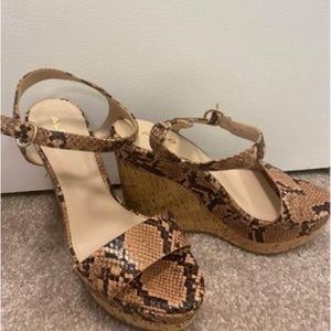 Aldo wedge heels, size US 7, snake pattern.